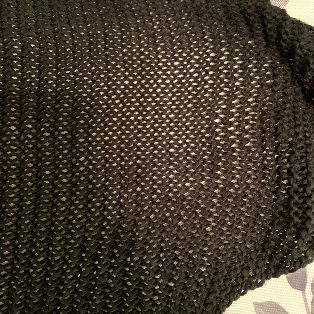 Black knit scarf, medium thick silk-like thread. No flaws. Like new